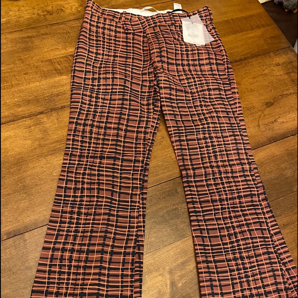 Bellbottom checkers pants.